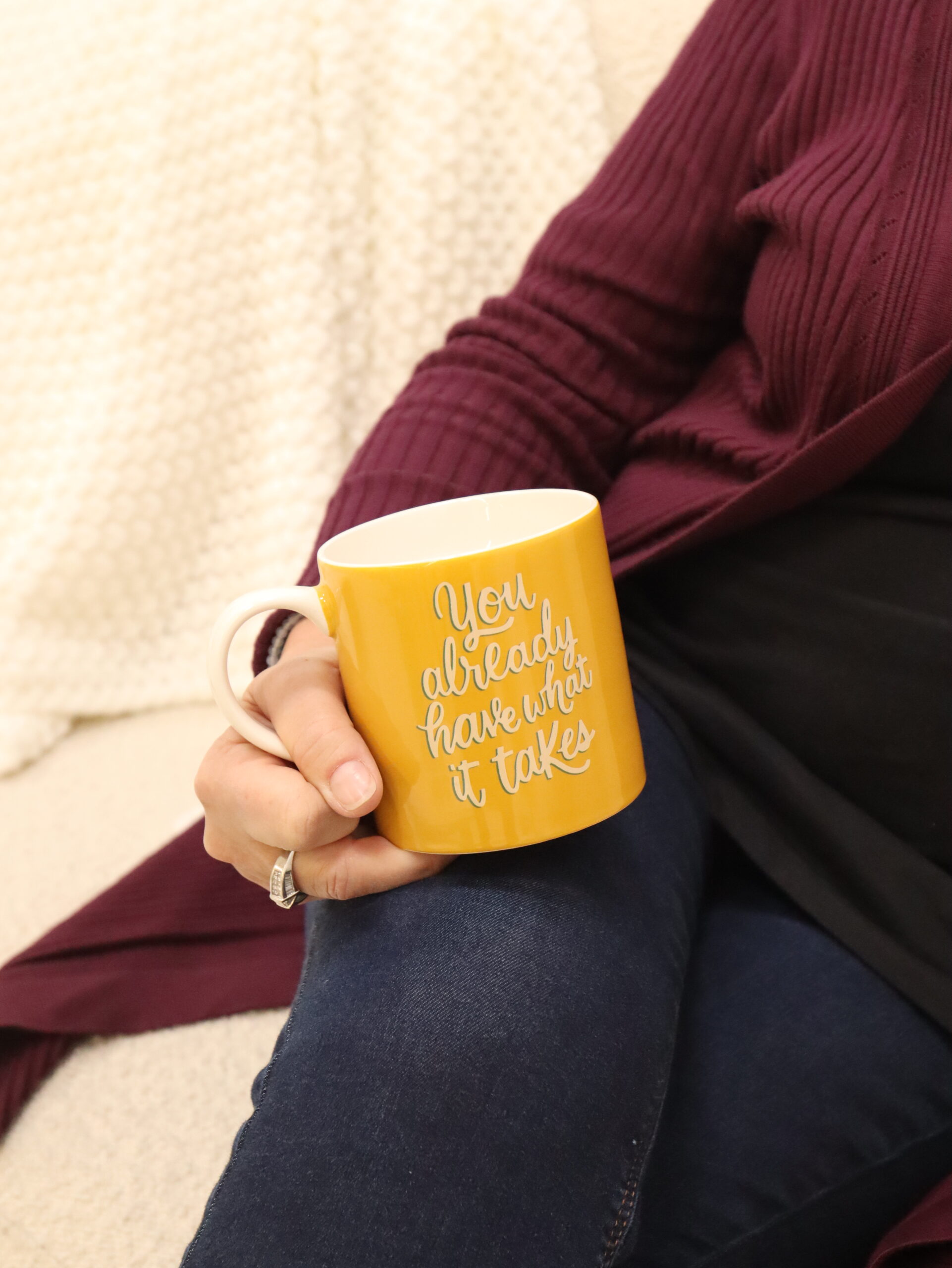 close up of yellow coffee mug with script font that reads "you already have what it takes." The Art of Compassion blog by Evoke Mind and Body, Wilmington, NC