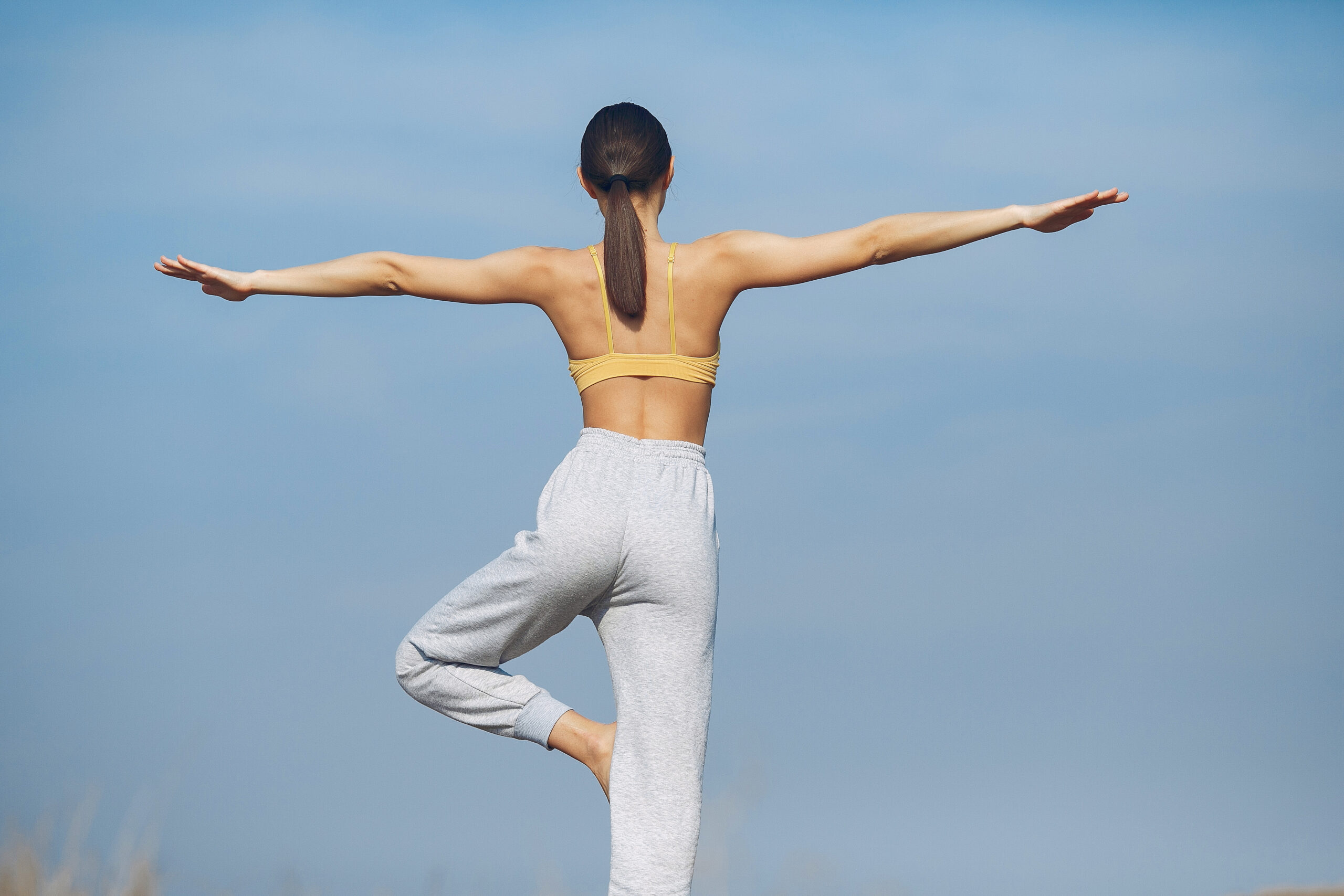 Woman practicing balance with yoga